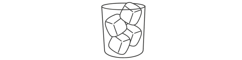 A glass filled with several ice cubes.